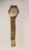 9ct gold gentleman's wristwatch with silver dial and baton hour markers, second sweep hand,