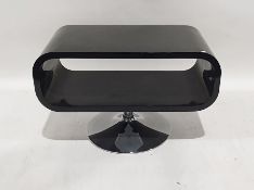 Modern television stand in black curved finish, on chromed pedestal