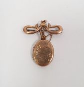 9ct gold bow brooch with gold-coloured pendant oval locket, engraved, 5g gross