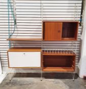 Ladderax-style wall unit with assorted teak cupboards, drawers, record spaces and fall shelf and