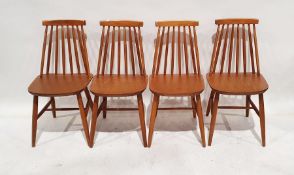 Four beech stick-back dining chairs