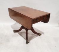 Regency mahogany and banded pembroke table on singular turned pedestal to four ogee reeded legs,