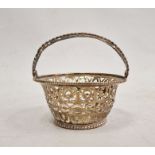 Foreign silver-coloured pierced flared cylindrical basket, the pierced swing handle within beaded