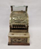 19th century brass "National" cash register (637250311) with ornate scroll and floral drape detailed