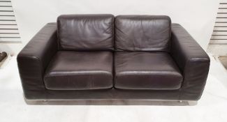 Modern brown leather two-seat sofa on chrome-coloured base