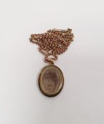 Gold and enamel locket front pendant, oval with brocade work decoration (back missing) and the 9ct