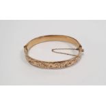 9ct gold bangle with safety chain, 15.2g (metal core, gold bonded, not solid gold)