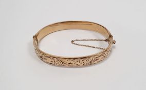 9ct gold bangle with safety chain, 15.2g (metal core, gold bonded, not solid gold)
