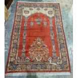 Eastern style red ground rug with mehrab & hanging lamps, floral and multiple geometric borders