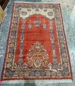 Eastern style red ground rug with mehrab & hanging lamps, floral and multiple geometric borders