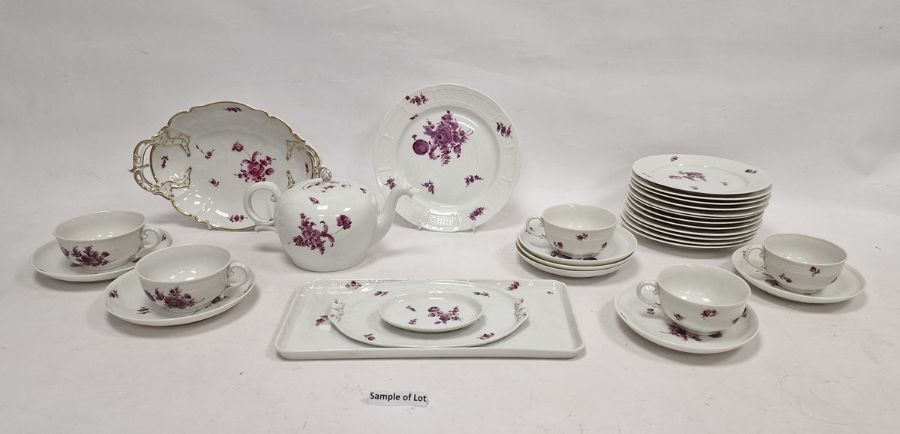 Nymphenburg porcelain part tea service decorated in puce with floral sprays and basket weave edge,
