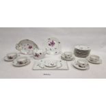 Nymphenburg porcelain part tea service decorated in puce with floral sprays and basket weave edge,