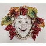 Perseo pottery Bachanalian wall mask with smiling face and fruiting vine, 42cm high x 44cm wide