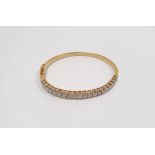 18ct gold bangle set with 20 diamonds, stamped 750, approx. 15g  Condition ReportInside diameter