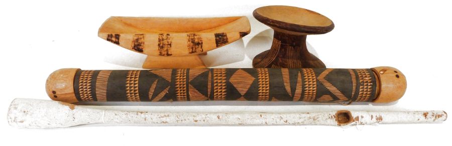 African carved quiver, a stool, an animal skin covered wooden pipe, and one further.