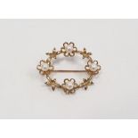 9ct yellow gold oval brooch set with four pearls, stamped 375