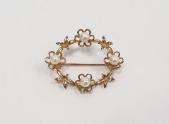 9ct yellow gold oval brooch set with four pearls, stamped 375