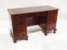 20th century desk with leather inset top, moulded edge, nine assorted drawers, on squat cabriole