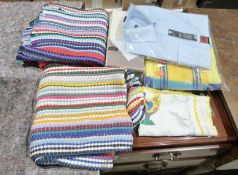 Box of assorted linen and fabric to include tea towels, rugs, bedsheets, etc