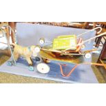 Child's vintage wheelbarrow, a child's vintage stuffed pushalong dog, a child's wooden jigsaw