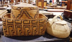 Three African-style wicker baskets (3)  rectangular basket - 59 x 27 cms. round basket - 35 cms diam