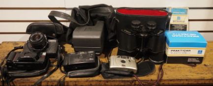 A collection of binoculars and cameras to include Hanimex 10x50, Praktika BC-1 SLR camera,