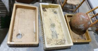 Three glazed pottery sinks / basins and a large terracotta ball (4)