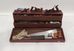 Vintage wooden toolbox containing numerous vintage tools to include saws, chisels, planes, drill