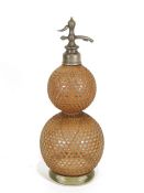 Vintage BA&Co London double-gourd-shaped soda syphon with cane fretwork exterior