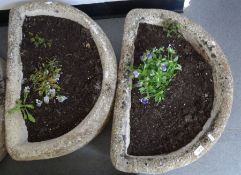 Pair of composite stone planters of semi-circular form, 18cm high x 63cm long approx. (2)