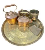 Two copper kettles, a copper pan, a brass trivet, a large embossed Middle Eastern circular brass