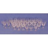 Set of 10 cut glass sherry glasses, a large quantity of cut glass drinking glasses, vases, bowls,