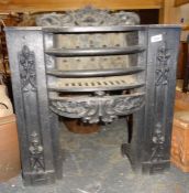 Cast iron fire grate with rococo style decoration