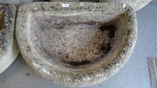 Pair of composite stone planters of semi-circular form, 18cm high x 63cm long approx. (2)