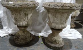 Pair of composite stone urns, 56cm high approx. (2)