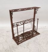 Cast iron boot rack with scrollwork decoration