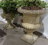 Pair of composite stone urns with grape and vine and mask decoration, 63cm high approx. (2)
