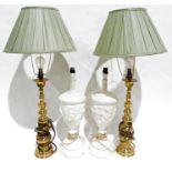 Pair of plaster urn-shaped table lamps with relief cherub decoration and a pair of brass table lamps