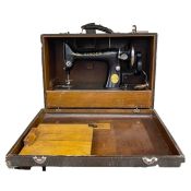 Singer sewing machine with case, serial number EC975934