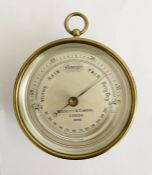 20th century brass cased compensated aneroid barometer produced by Short & Mason of London, the dial