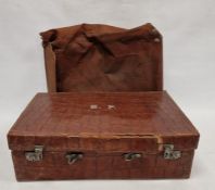 A crocodile skin suitcase, early to mid 20th century, gilt lettering stamped for John Bagshaw &