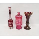 Collection of Bohemian ruby glass comprising a late 19th century faceted flared gilt ruby vase