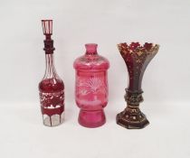 Collection of Bohemian ruby glass comprising a late 19th century faceted flared gilt ruby vase