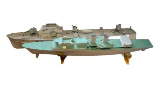 Two painted pond boats designed as battleships (2)