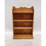Modern pine open bookcase with three-quarter galleried back above the four shelves, on plinth