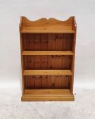 Modern pine open bookcase with three-quarter galleried back above the four shelves, on plinth