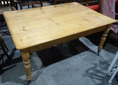 Late 19th/early 20th century pine table, the rectangular top with canted corners above single