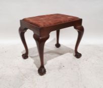 Early 20th century mahogany stool with upholstered seat, on cabriole legs terminating to claw and