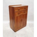 20th century oak cupboard with two drawers above two panelled cupboard doors, raised to plinth,