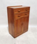 20th century oak cupboard with two drawers above two panelled cupboard doors, raised to plinth,